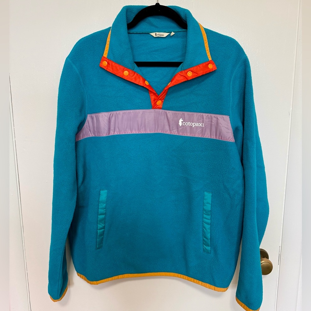 Cotopaxi Blue Fleece with Orange and Purple Accents